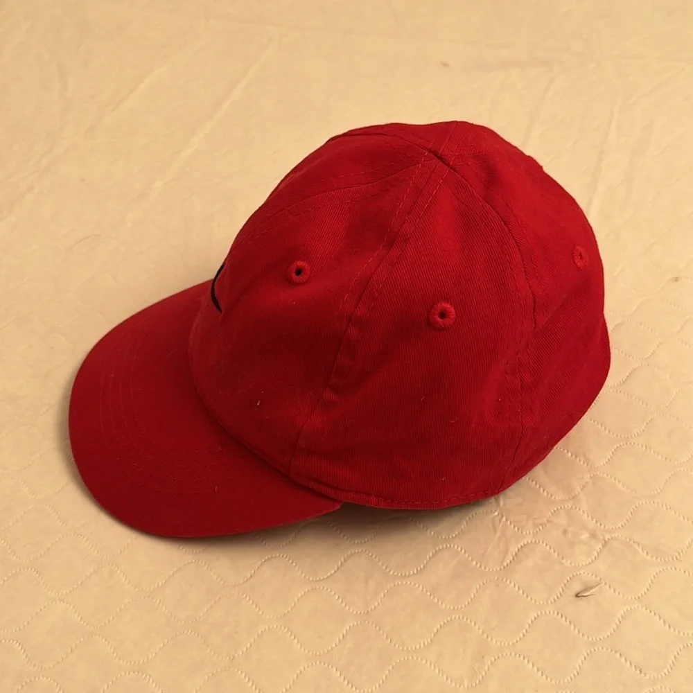 Nike red infant adjustable baseball hat with black swoosh